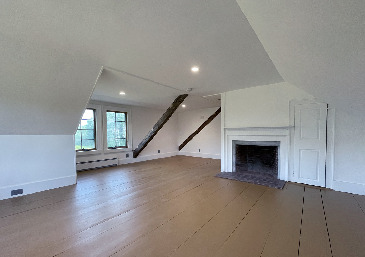 fireplace-and-dormer-area-of-upstairs-bedroom-suite.jpg