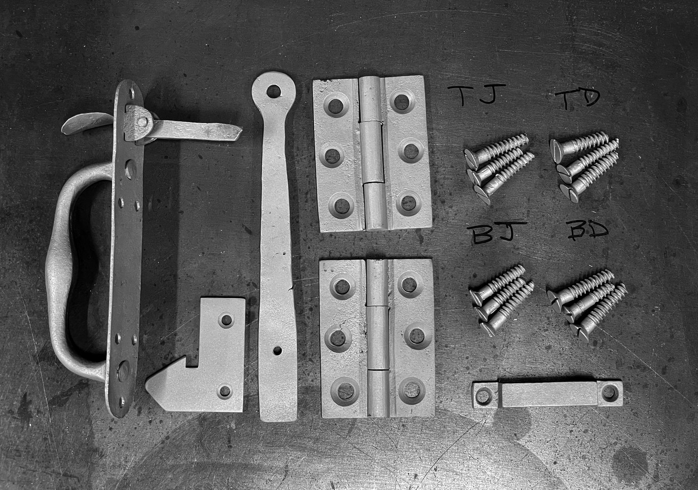 latch-parts-and-hinges-after-blasting.jpg