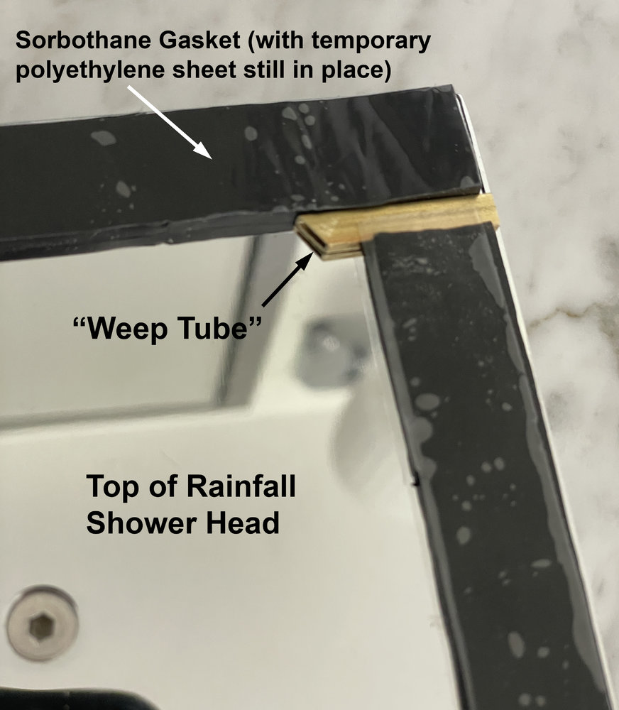 rainfall-shower-head-wth-gasket-and-weep-tube-close-up.jpg